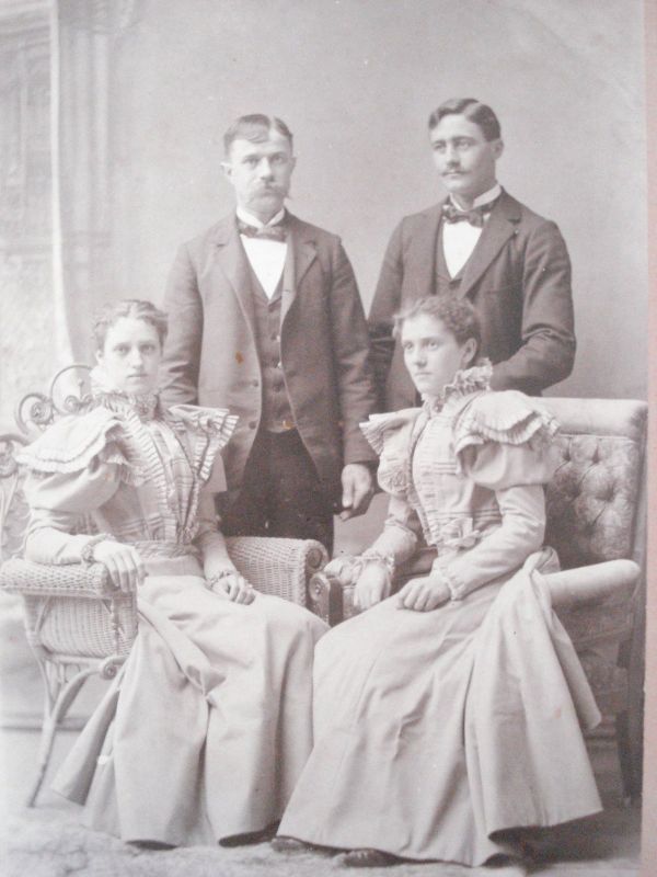 cabinet card couple posing on wicker chairs